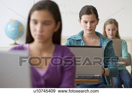 Students working on laptops View Large Photo Image Stock Photo - Students working on laptops. Fotosearch