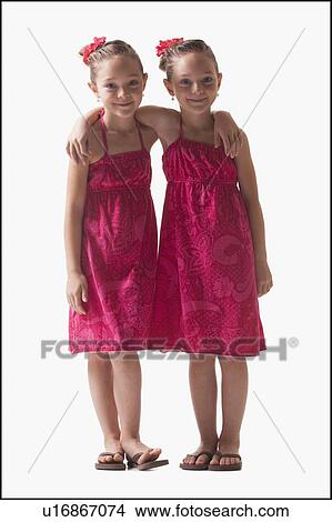 Twins embrace View Large Photo Image Picture - Twins embrace. Fotosearch