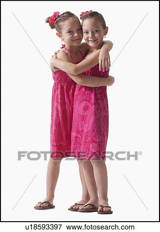 Stock Photo - Twins embrace. Fotosearch