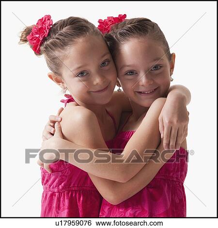 Twins embrace View Large Photo Image Stock Photograph - Twins embrace. Fotosearch