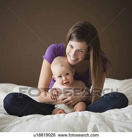 Woman and baby View Large Photo Image Stock Photo - Woman and baby. Fotosearch