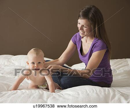 Woman and baby View Large Photo Image Stock Photo - Woman and baby. Fotosearch