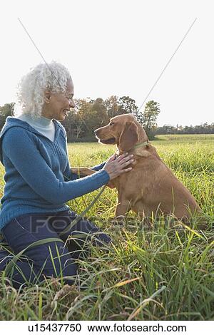 Woman and her dog View Large Photo Image Stock Image - Woman and her dog. Fotosearch