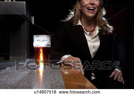 Woman at bar View Large Photo Image Stock Photo - Woman at bar. Fotosearch