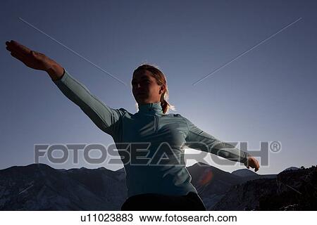 Woman doing yoga outdoors View Large Photo Image Stock Image - Woman doing yoga outdoors. Fotosearch