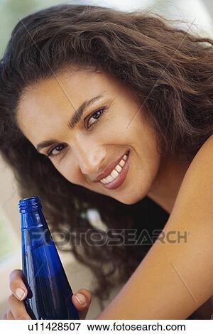 Woman drinking bottled water View Large Photo Image Stock Photo - Woman drinking bottled water. Fotosearch