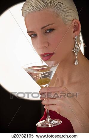 Stock Photography - Woman drinking martini. Fotosearch
