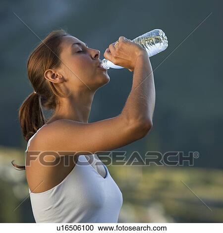 Woman drinking water View Large Photo Image Stock Image - Woman drinking water. Fotosearch