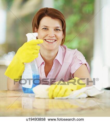 Stock Photo - Woman housecleaning. Fotosearch