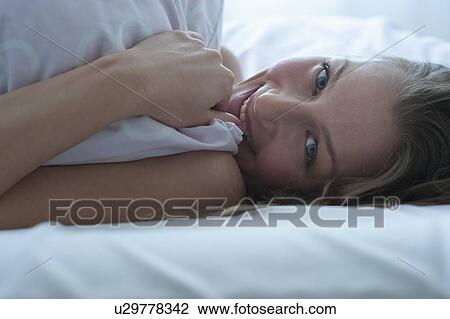 Stock Image - Woman in bed. Fotosearch