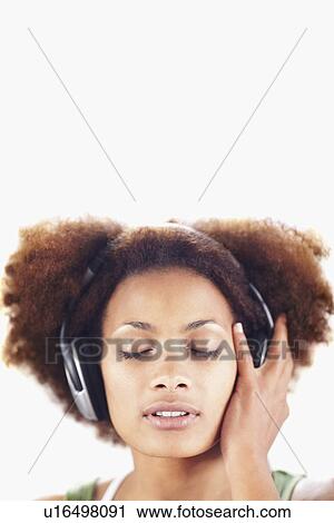 Woman listening to music View Large Photo Image Stock Image - Woman listening to music. Fotosearch