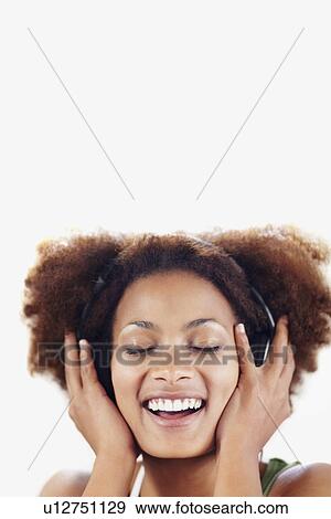 Woman listening to music View Large Photo Image Stock Photo - Woman listening to music. Fotosearch