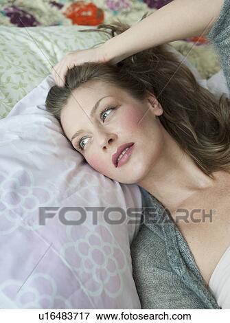 Stock Photo - Woman lying down. Fotosearch