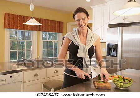 Stock Photo - Woman preparing salad. Fotosearch