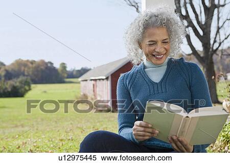 Stock Photography - Woman reading a book. Fotosearch