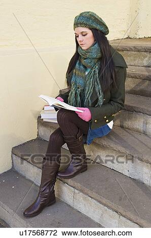 Woman reading book on steps View Large Photo Image Stock Image - Woman reading book on steps. Fotosearch
