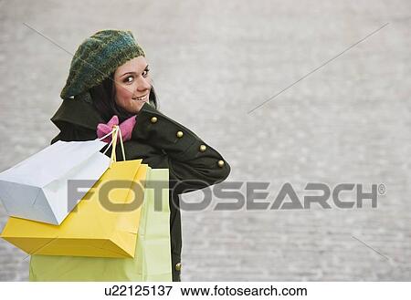 Stock Photo - Woman shopping. Fotosearch