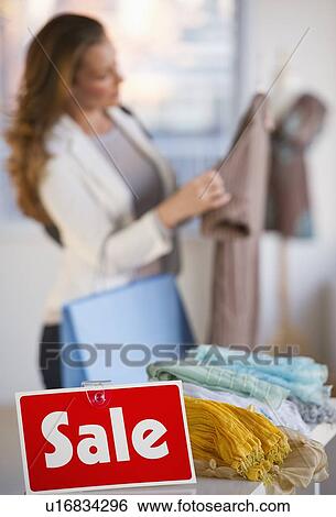Stock Photograph - Woman shopping. Fotosearch