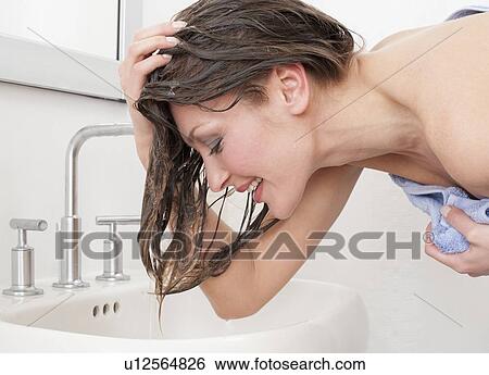 Stock Photograph - Woman washing hair. Fotosearch