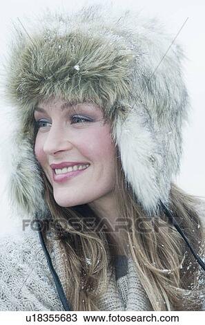 Stock Image - Woman wearing fur hat. Fotosearch