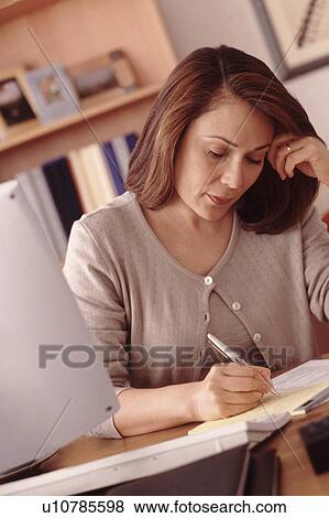 Stock Photo - Woman working at computer. Fotosearch