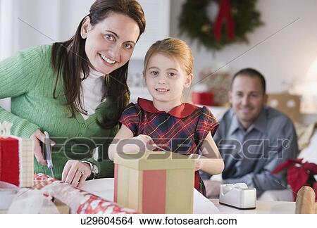 Wrapping presents View Large Photo Image Picture - Wrapping presents. Fotosearch