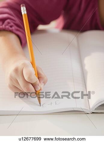 Young girl doing math homework View Large Photo Image Stock Photo - Young girl doing math homework. Fotosearch