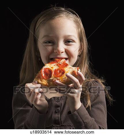 Young girl eating pizza View Large Photo Image Picture - Young girl eating pizza. Fotosearch