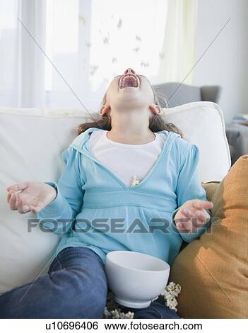 Stock Photograph - Young girl laughing. Fotosearch