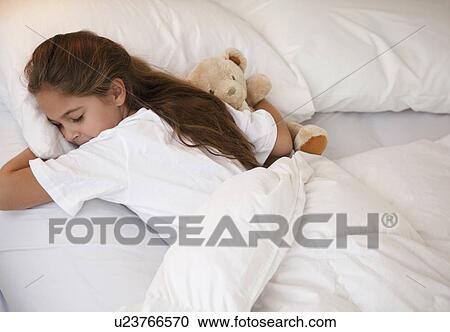 Stock Image - Young girl sleeping. Fotosearch