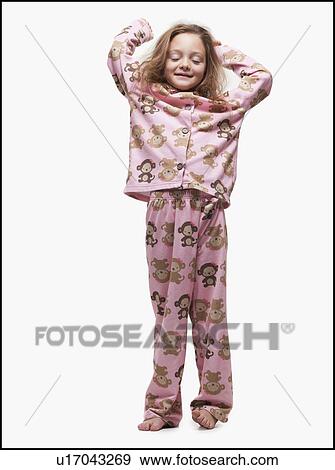Young girl wearing pajamas View Large Photo Image Stock Photo - Young girl wearing pajamas. Fotosearch