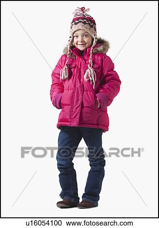 Stock Image - Young girl wearing winter clothing. Fotosearch