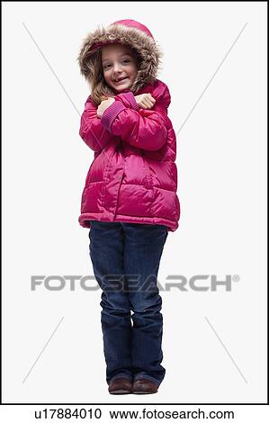 Stock Image - Young girl wearing winter clothing. Fotosearch