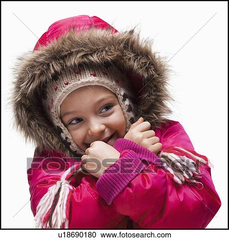 Stock Image - Young girl wearing winter clothing. Fotosearch