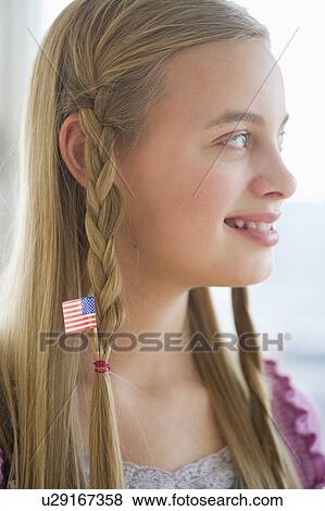 Stock Photo - Young girl with American flag in hair. Fotosearch