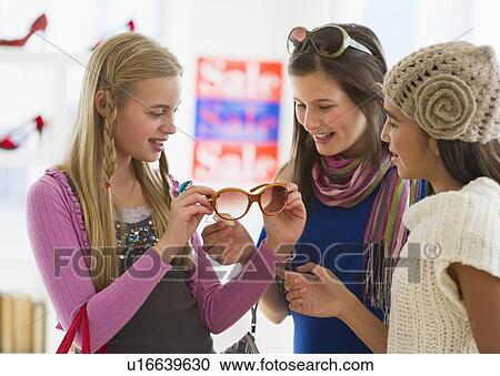 Stock Image - Young girls shopping. Fotosearch