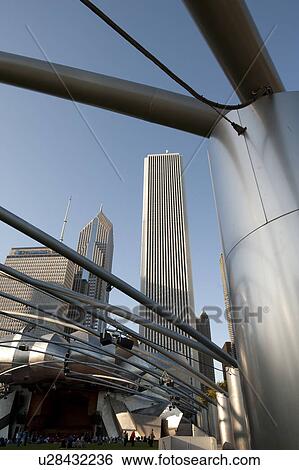 Stock Photograph - Buildings in downtown Chicago, through the overhang at The Pritzker Pavilion. Fotosearch