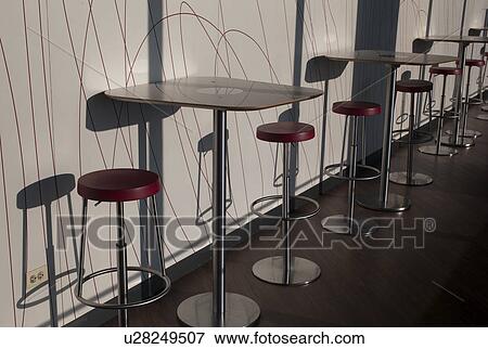 Stock Photo - Empty tables and chair stools at Chicago, John Hancock Centre. Fotosearch