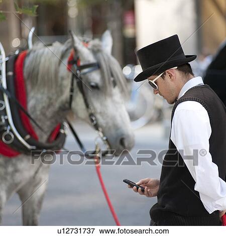 Man and a horses in downtown Chicago View Large Photo Image Stock Photo - Man and a horses in downtown Chicago. Fotosearch