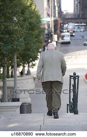 Man walking on sidewalk on Chicago Street View Large Photo Image Stock Image - Man walking on sidewalk on Chicago Street. Fotosearch