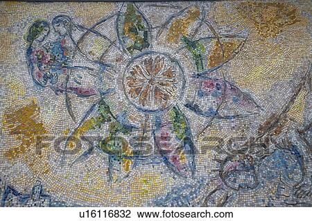 Stock Image - Painted mosaic tiles on a wall in Chicago. Fotosearch