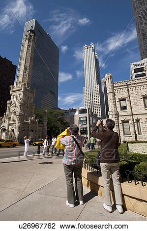 People on the street in Chicago, Old Water Tower View Large Photo Image Stock Image - People on the street in Chicago, Old Water Tower. Fotosearch