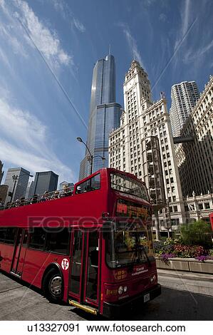Red double deck tour bus in Chicago with Trump Tower, Wrigley Building in background View Large Photo Image Stock Image - Red double deck tour bus in Chicago with Trump Tower, Wrigley Building in background. Fotosearch