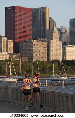 Stock Photography - Woman jogging in Chicago . Fotosearch
