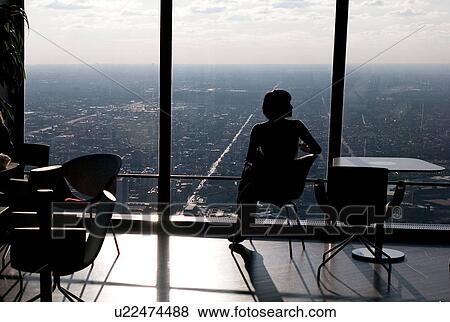 Woman sitting by window at Chicago, John Hancock Centre View Large Photo Image Stock Photo - Woman sitting by window at Chicago, John Hancock Centre. Fotosearch