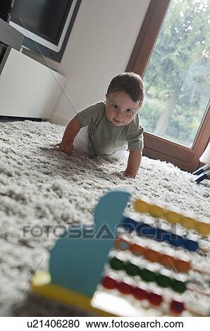 Baby boy crawling toward abacus View Large Photo Image Stock Image - Baby boy crawling toward abacus. Fotosearch