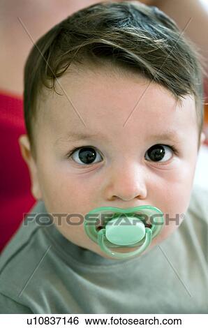 Baby boy with pacifier View Large Photo Image Stock Photograph - Baby boy with pacifier. Fotosearch