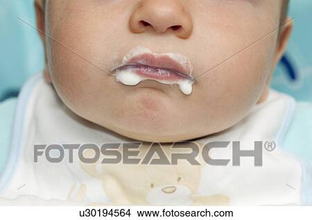Closeup of baby boy's mouth with food around it View Large Photo Image Picture - Closeup of baby boy's mouth with food around it. Fotosearch
