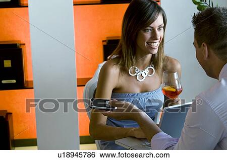 Couple at laptop and mobile phone View Large Photo Image Stock Photograph - Couple at laptop and mobile phone. Fotosearch