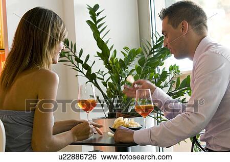Couple with orange wine View Large Photo Image Stock Photograph - Couple with orange wine. Fotosearch